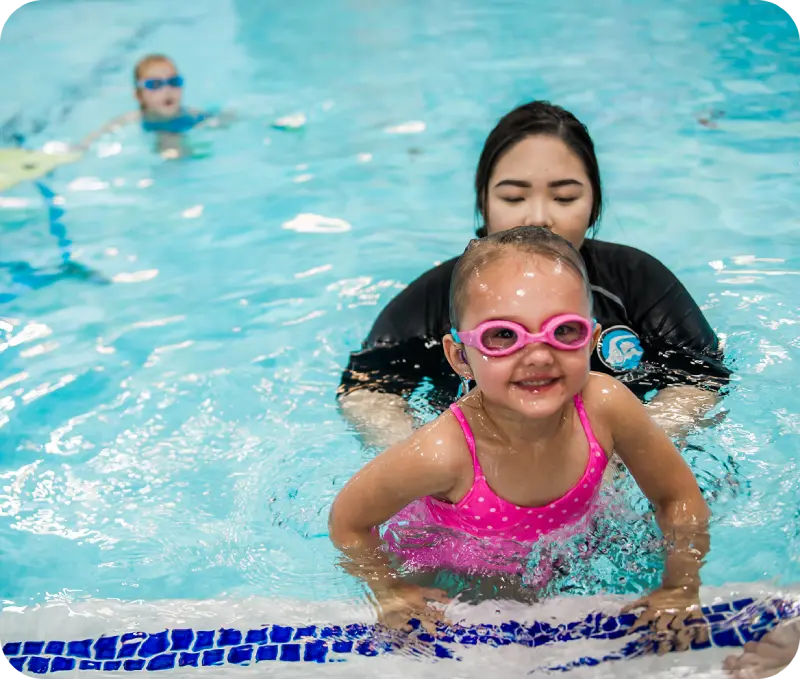 Photos of swim lessons and community events at FINS Swim School Atascocita
