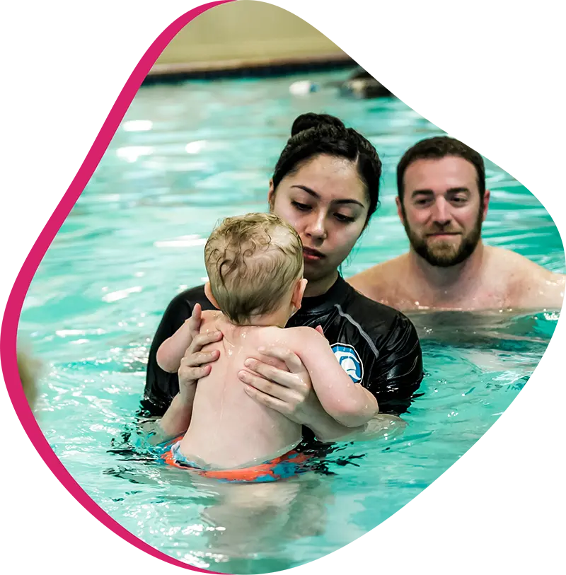 An adult swimmer receiving personalized one-on-one coaching from a FINS instructor in Atascocita.