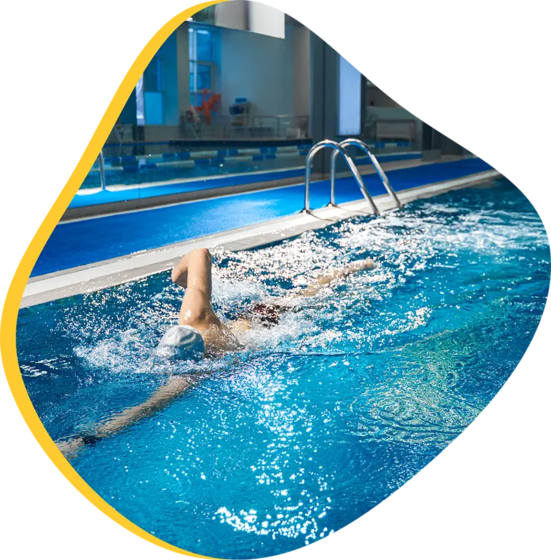 An adult swimmer receiving personalized one-on-one coaching from a FINS instructor in Atascocita.