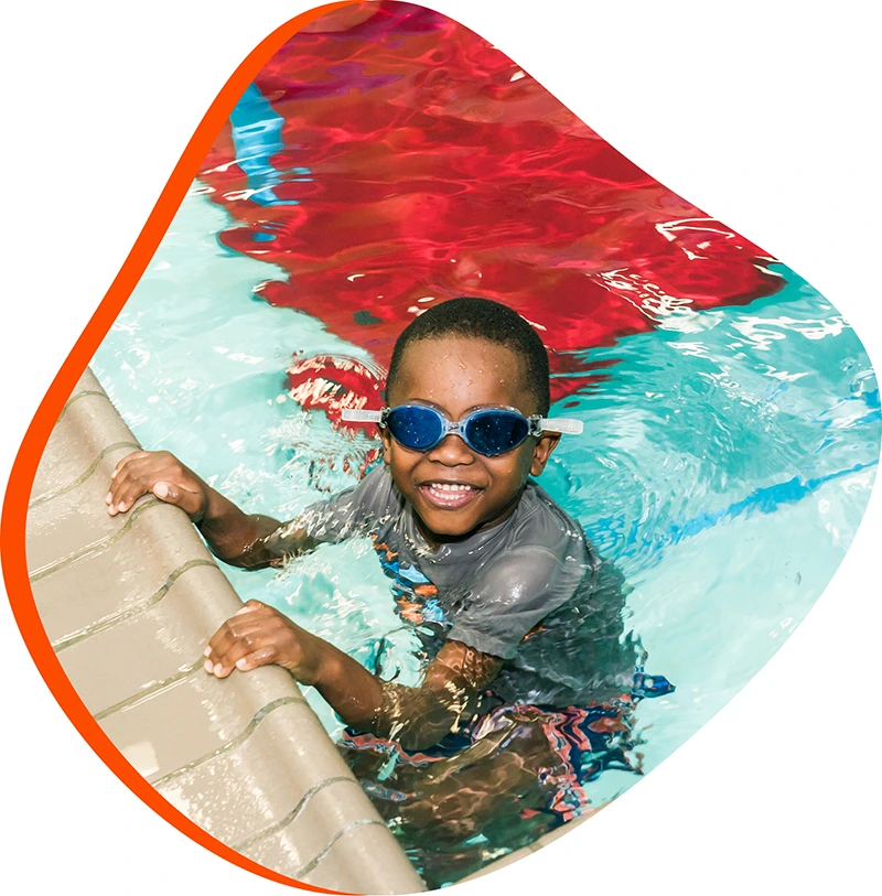An adult swimmer receiving personalized one-on-one coaching from a FINS instructor in Atascocita.