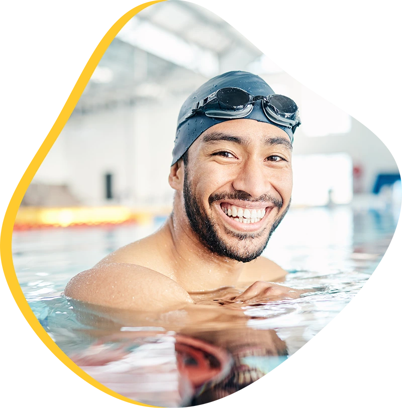 An adult swimmer receiving personalized one-on-one coaching from a FINS instructor in Atascocita.