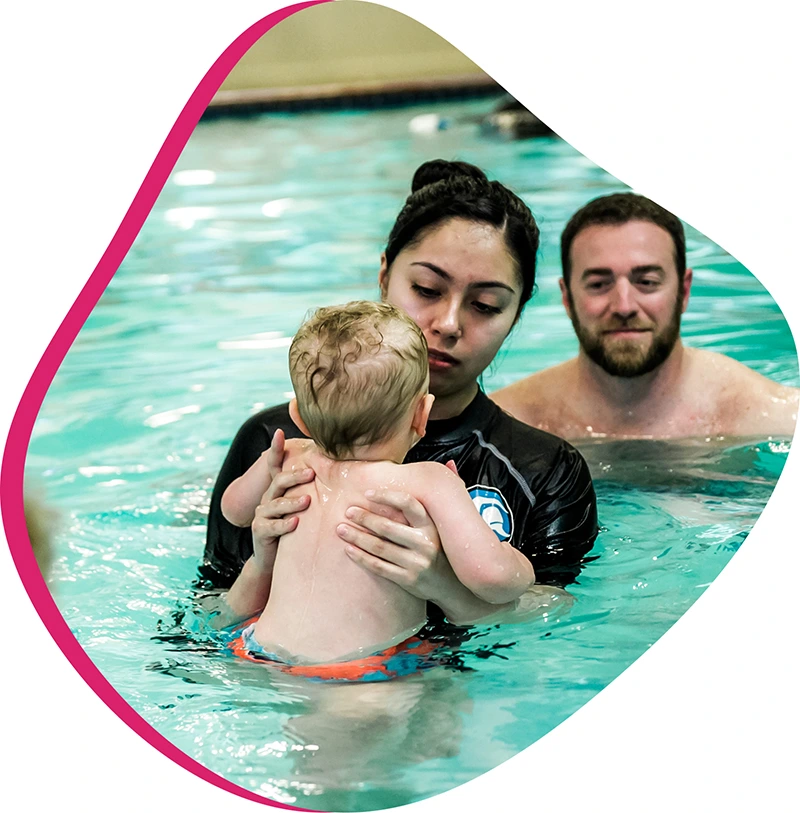 An adult student practices breath control and stroke technique during a private swim lesson at FINS Swim School.