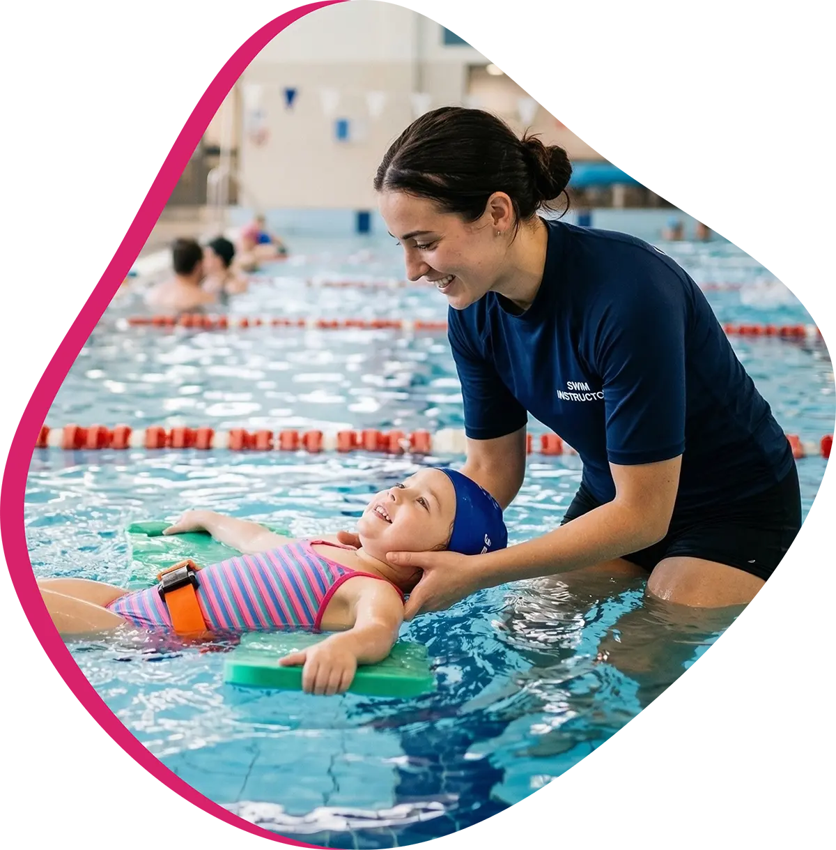 Swim instructor teaching a child during a focused one-on-one lesson in an indoor pool.