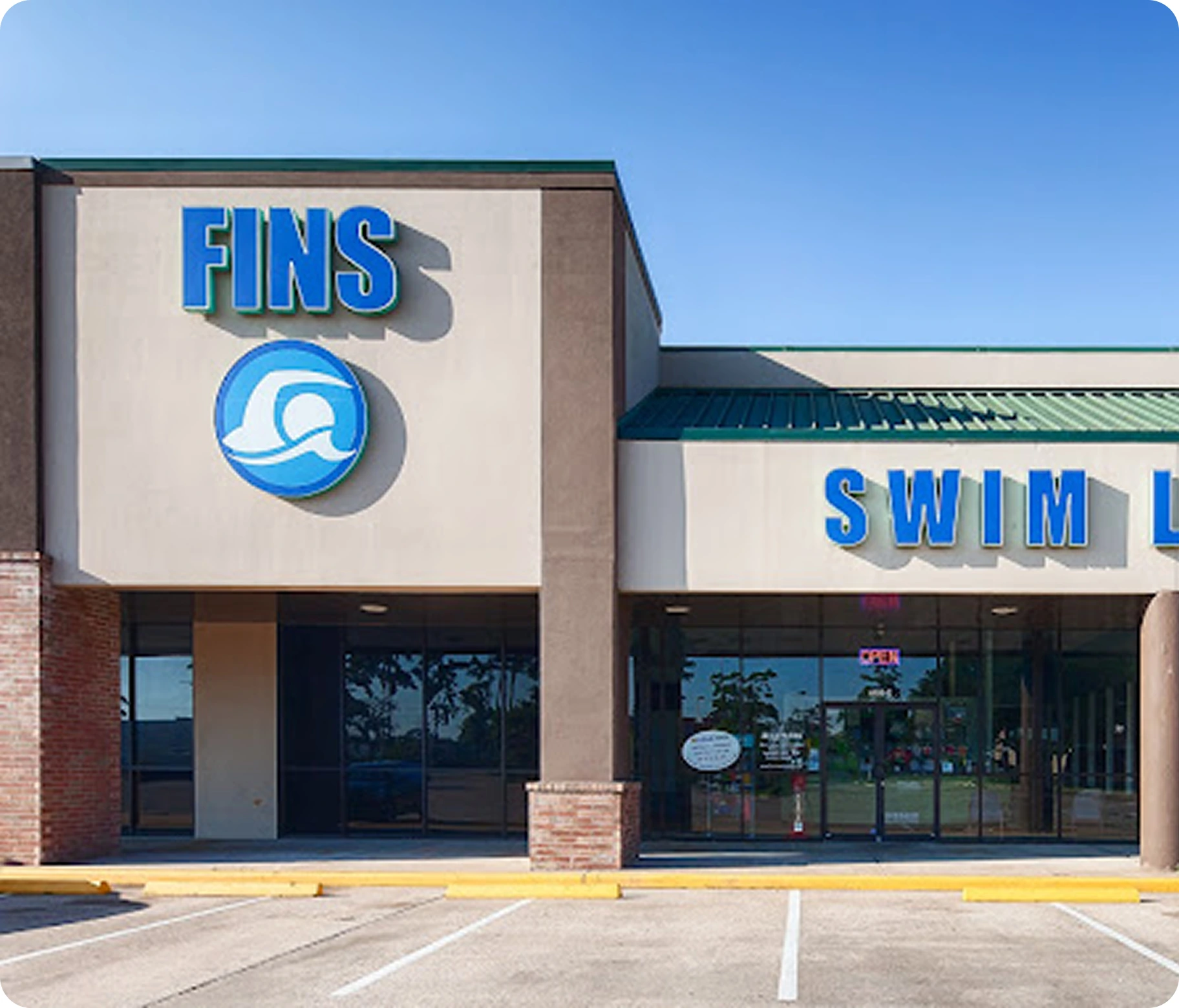 Photos of swim lessons and community events at FINS Swim School Atascocita
