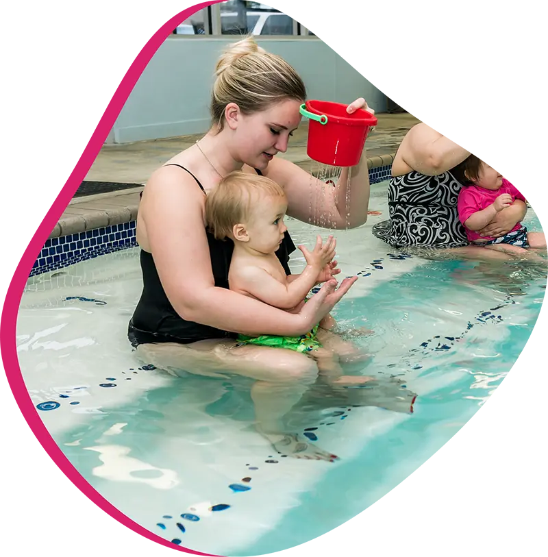 An adult swimmer receiving personalized one-on-one coaching from a FINS instructor in Atascocita.