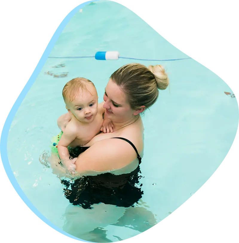 An adult swimmer receiving personalized one-on-one coaching from a FINS instructor in Atascocita.