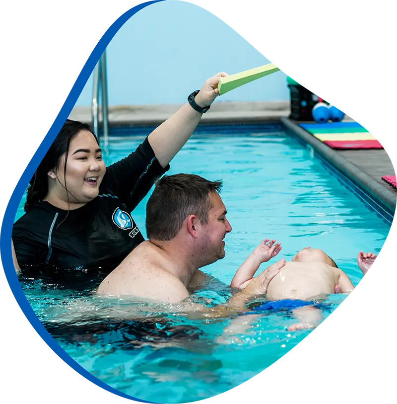 An adult swimmer receiving personalized one-on-one coaching from a FINS instructor in Atascocita.