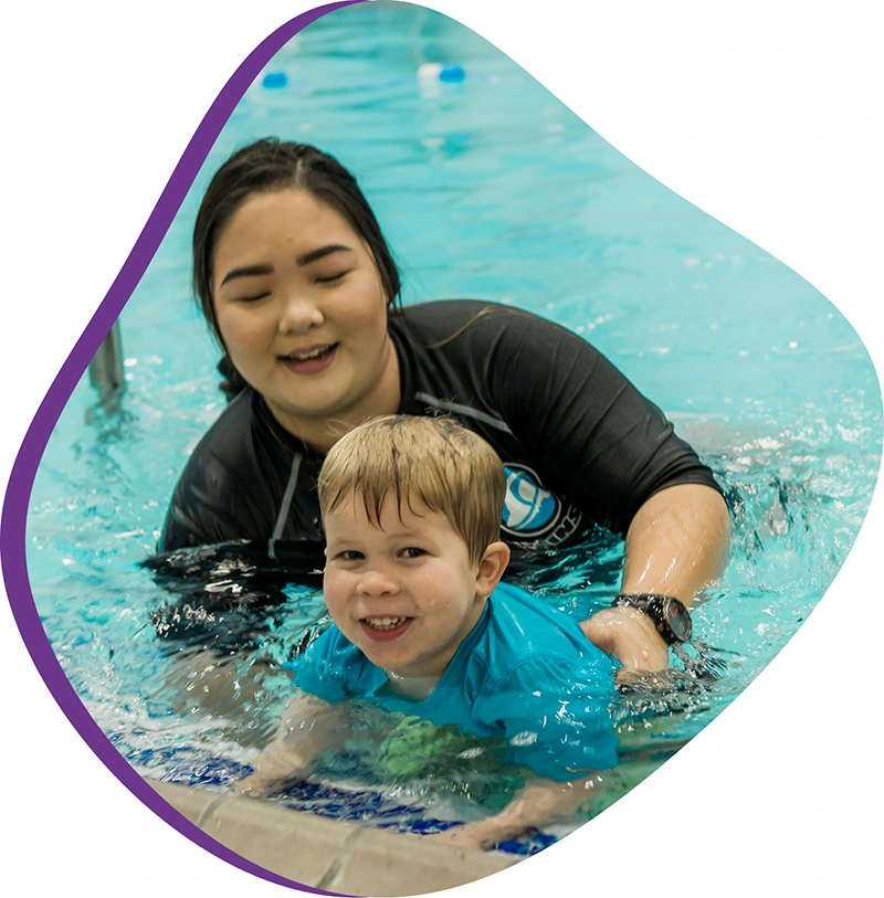 A parent and infant participating in a gentle water acclimation class at FINS Atascocita.