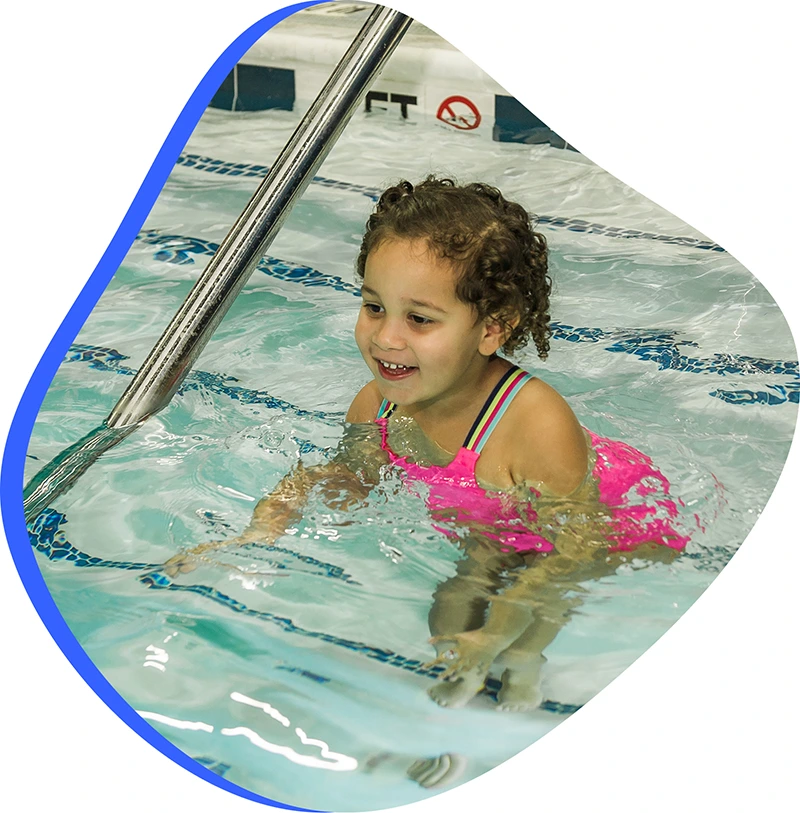 A parent and infant participating in a gentle water acclimation class at FINS Atascocita.