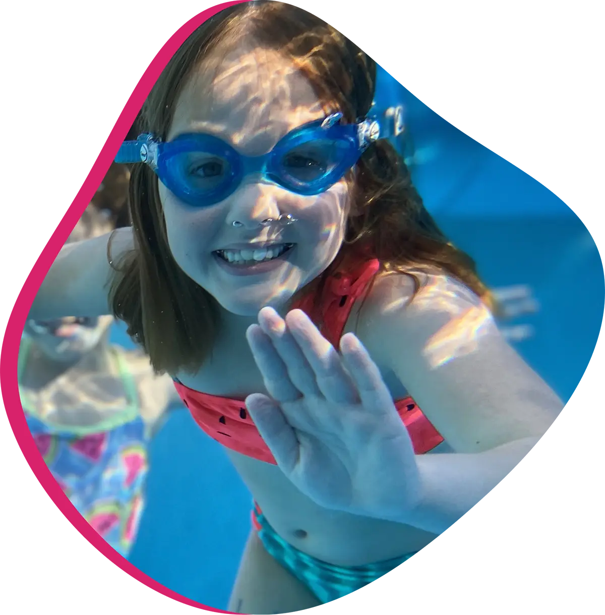  A swimmer receiving one-on-one swim instruction at FINS Swim School.