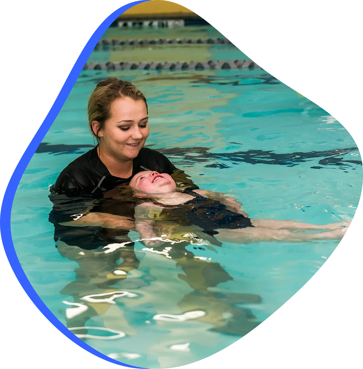 FINStructor guiding a swimmer during a private 1-on-1 swim lesson at FINS Swim School.