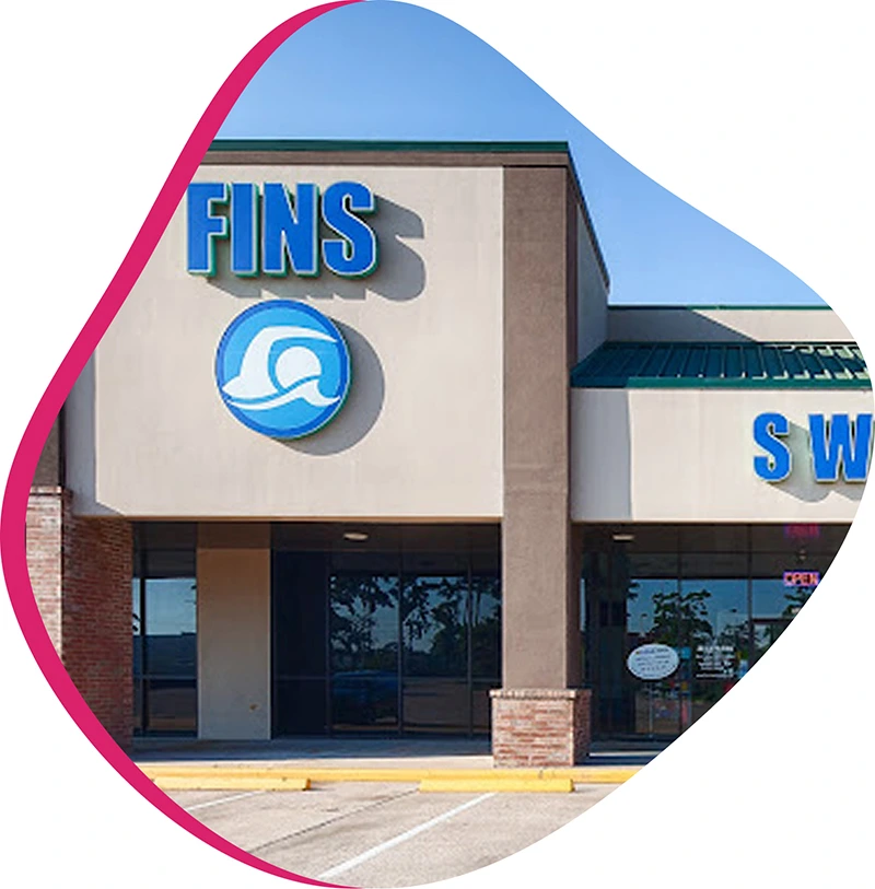 The FINS leadership team and professional instructors collaborating at our Grand Parkway indoor swim facility.
