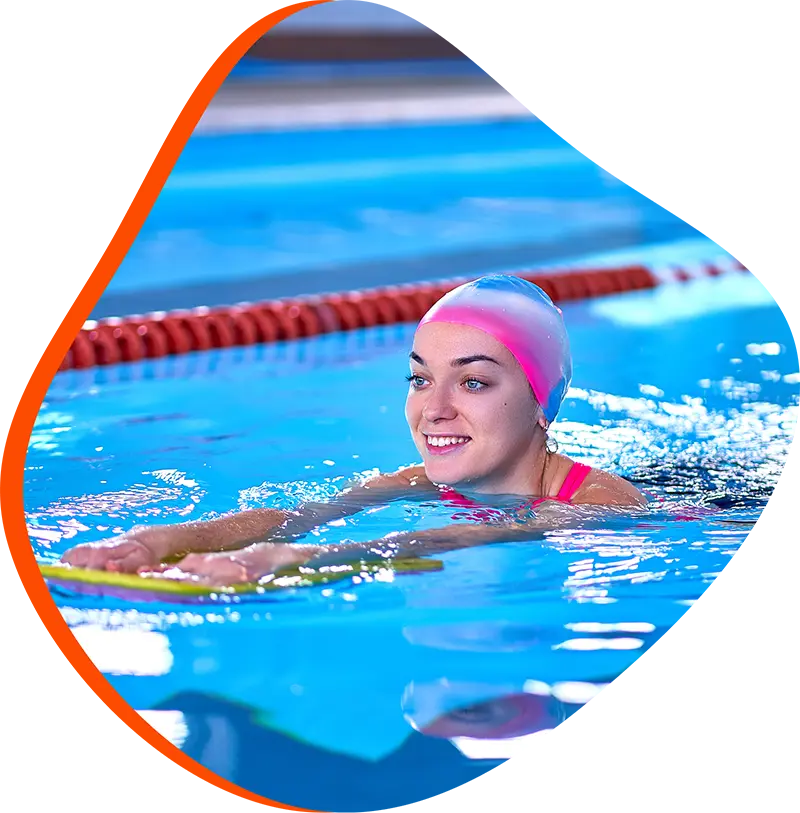  An adult swimmer receiving personalized one-on-one coaching from a FINS instructor in Cypress.