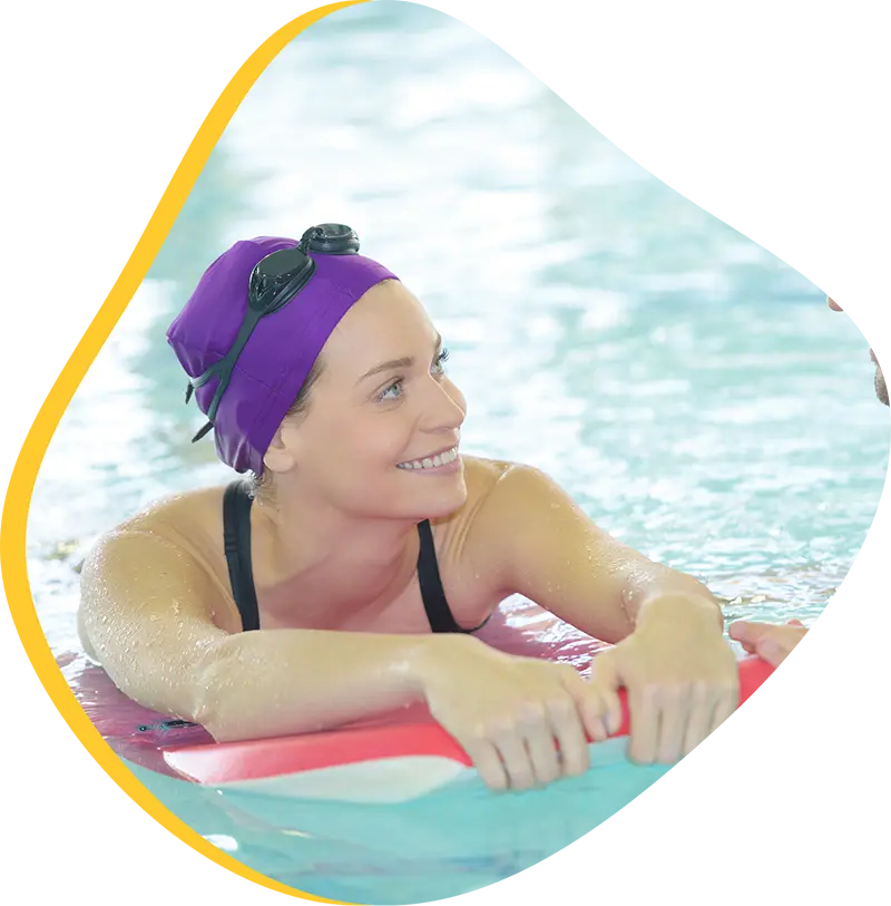 An adult swimmer receiving personalized one-on-one coaching from a FINS instructor in Atascocita.