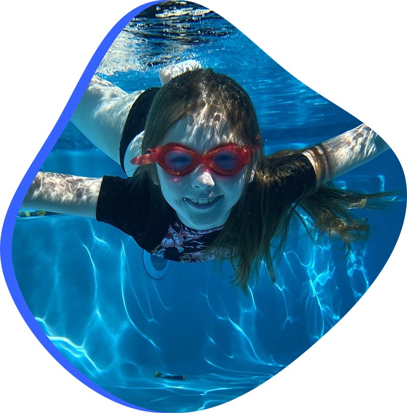 Parent actively supervising child during swim safety practice