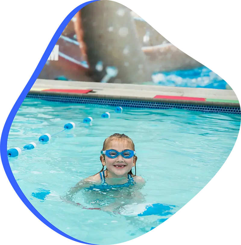 Parent and infant participating in a guided swim lesson with a finstructor at the FINS Fleet indoor pool.