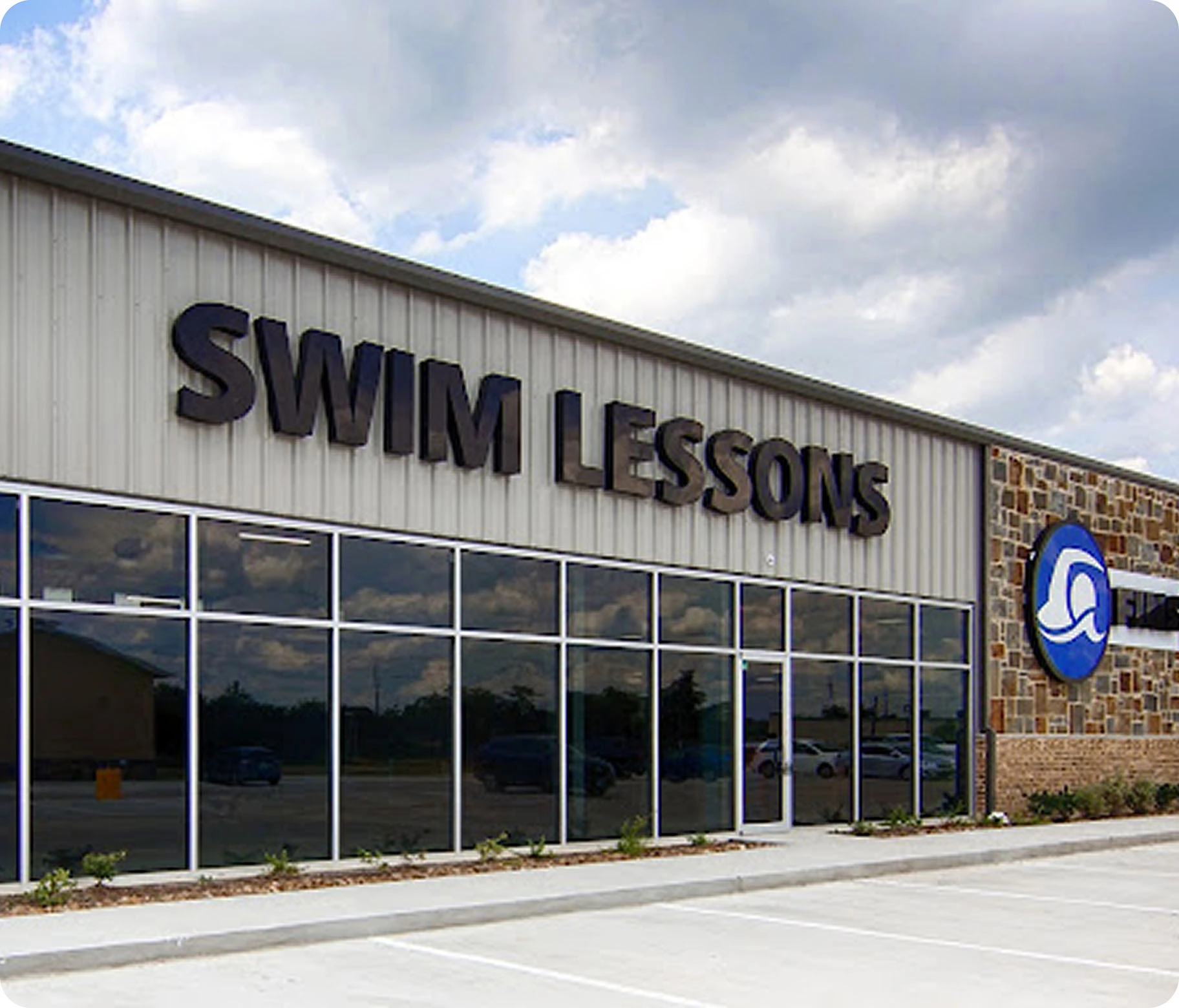 Photos of swim lessons and community events at FINS Swim School Cypress