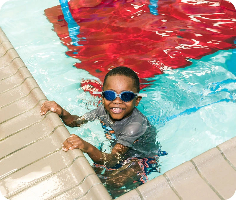 Photos of swim lessons and community events at FINS Swim School Cypress