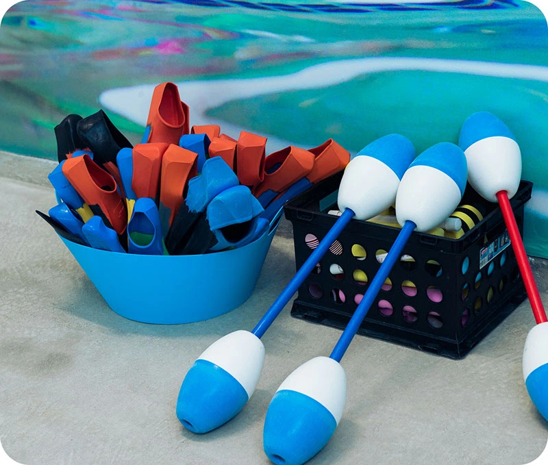 Photos of swim lessons and community events at FINS Swim School Cypress