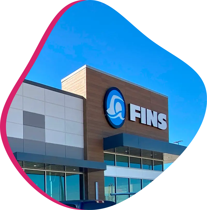 Front entrance of FINS Swim School Grand Parkway swim lesson facility in Texas.