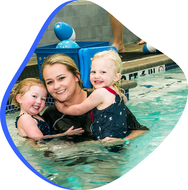 A parent and infant participating in a gentle water acclimation class at FINS Atascocita.