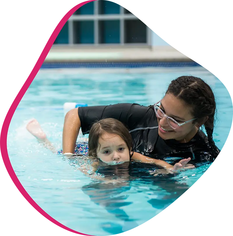  A parent and infant participating in a gentle water acclimation class at FINS Atascocita.