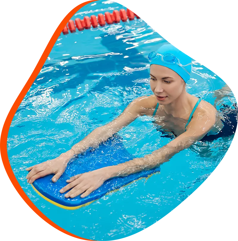 An adult swimmer receiving personalized one-on-one coaching from a FINS instructor in Atascocita.