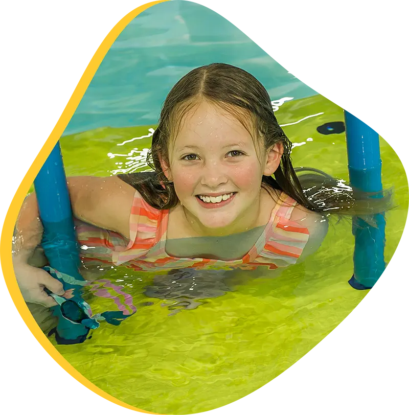 An adult swimmer receiving personalized one-on-one coaching from a FINS instructor in Atascocita.