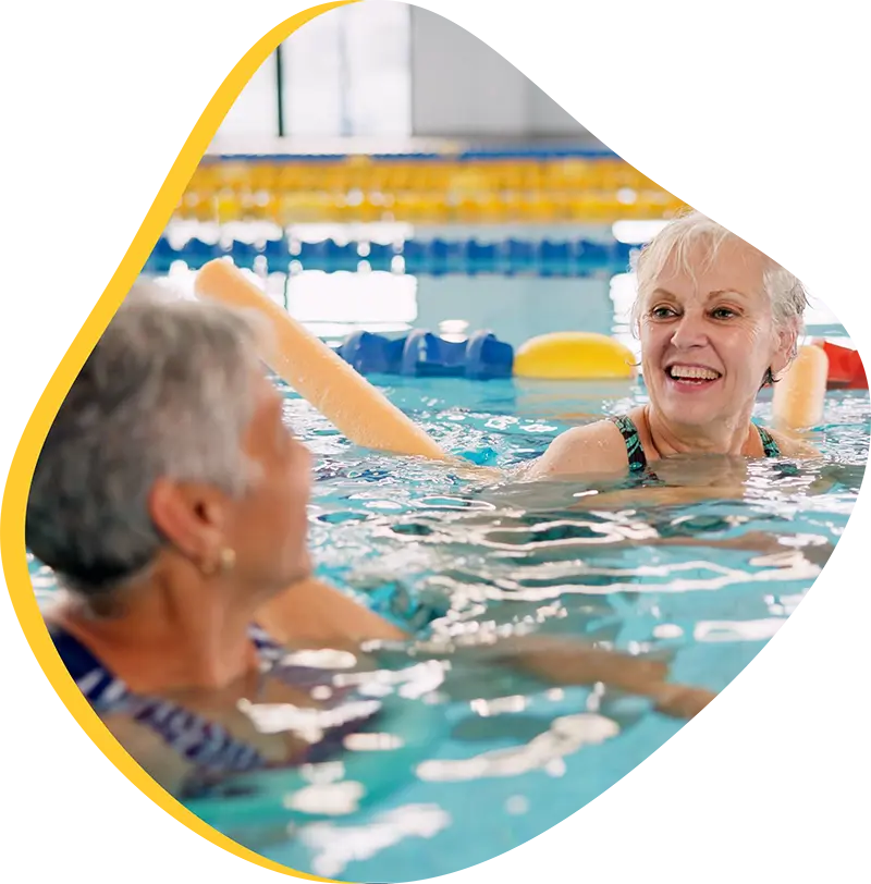 An adult swimmer receiving personalized one-on-one coaching from a FINS instructor in Atascocita.