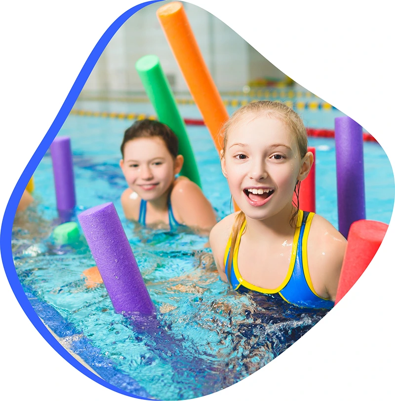 An adult swimmer receiving personalized one-on-one coaching from a FINS instructor in Atascocita.