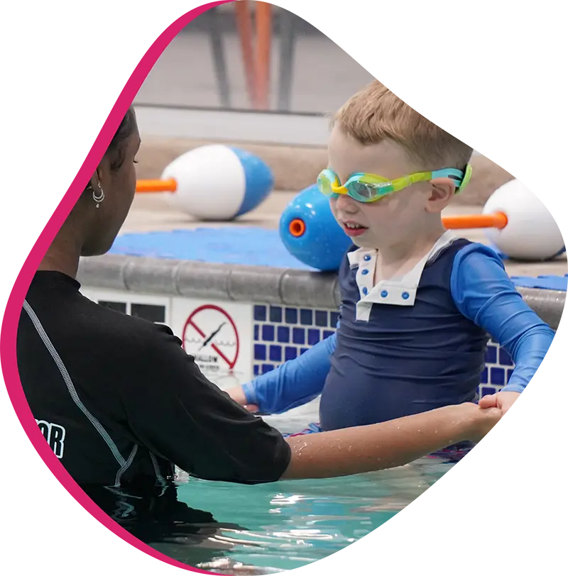 A child swimmer practicing efficient freestyle strokes during a private lesson at FINS The Woodlands.