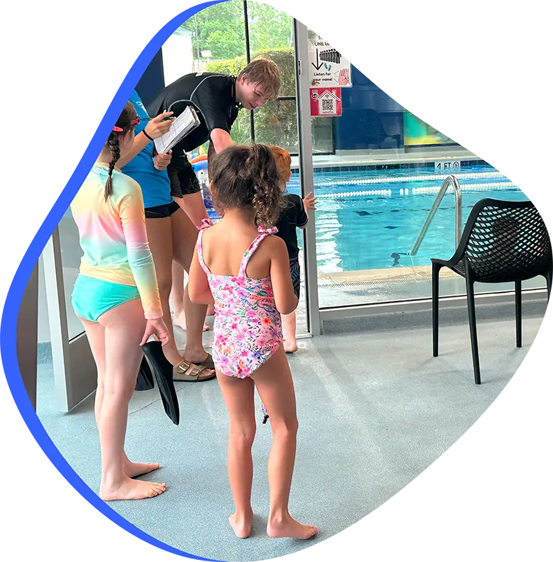 A child swimmer practicing efficient freestyle strokes during a private lesson at FINS The Woodlands.