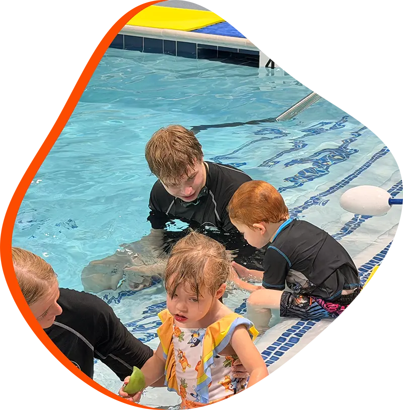 A child swimmer practicing efficient freestyle strokes during a private lesson at FINS The Woodlands.
