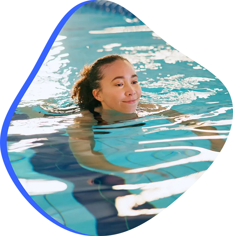 An adult swimmer receiving personalized one-on-one coaching from a FINS instructor in The Woodlands.