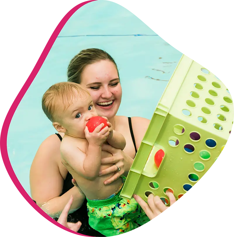 A parent and infant participating in a gentle water acclimation class at FINS 2978.