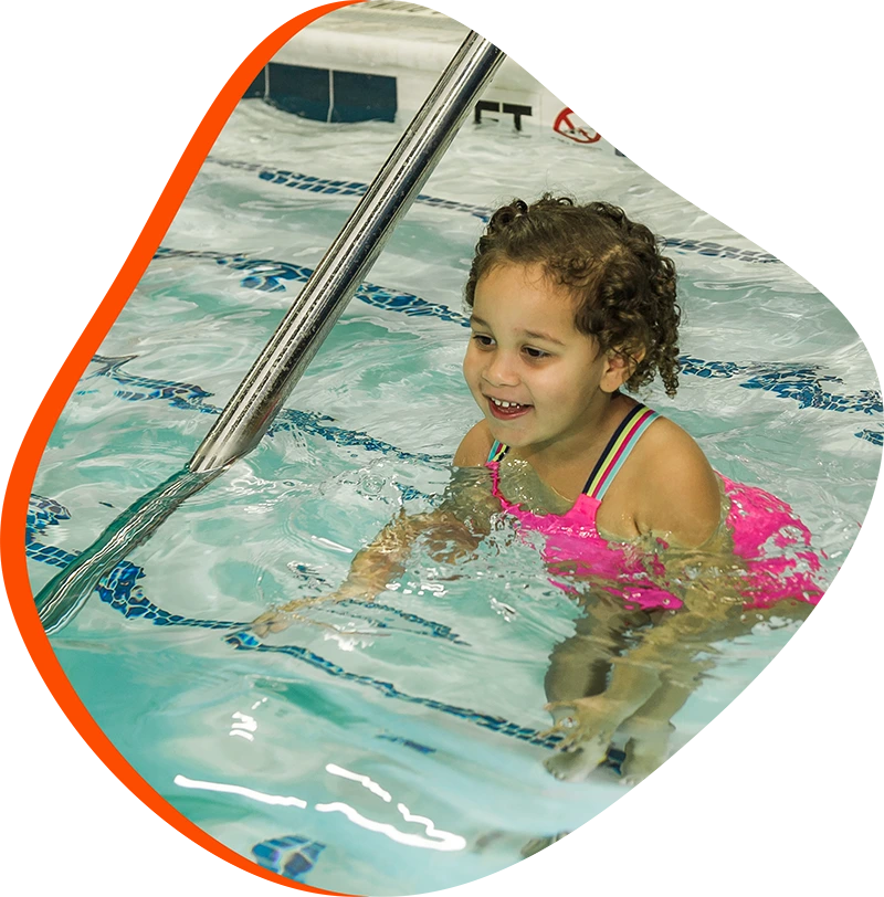 An adult swimmer receiving personalized one-on-one coaching from a FINS instructor in Atascocita.