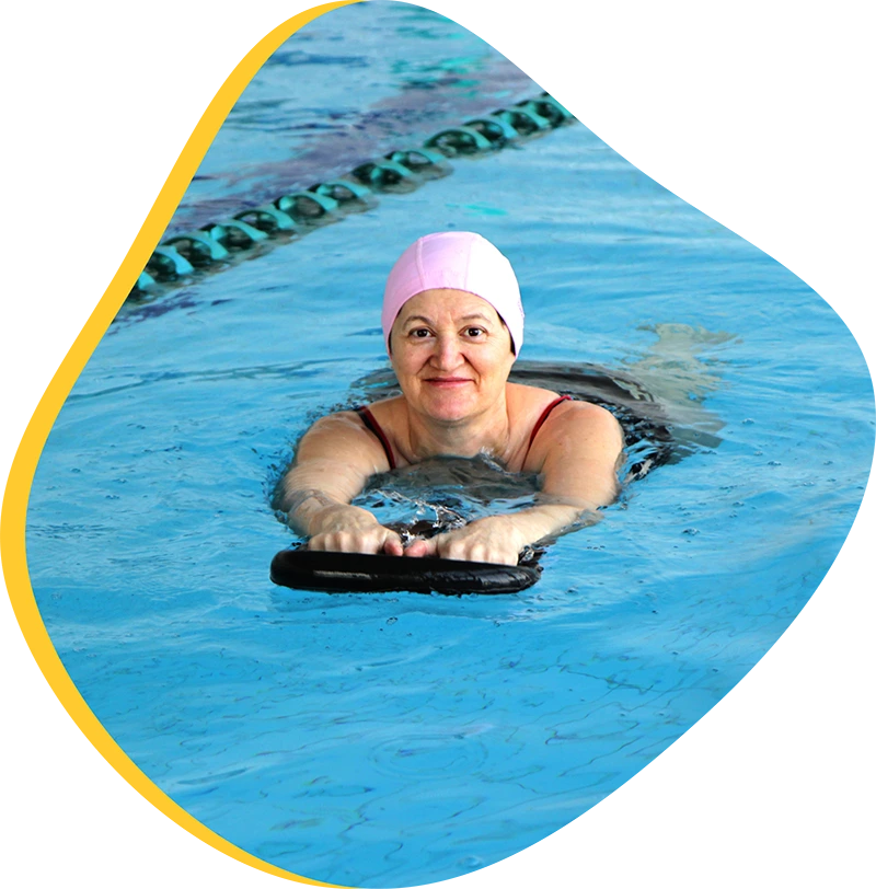 An adult swimmer receiving personalized one-on-one coaching from a FINS instructor in Atascocita.